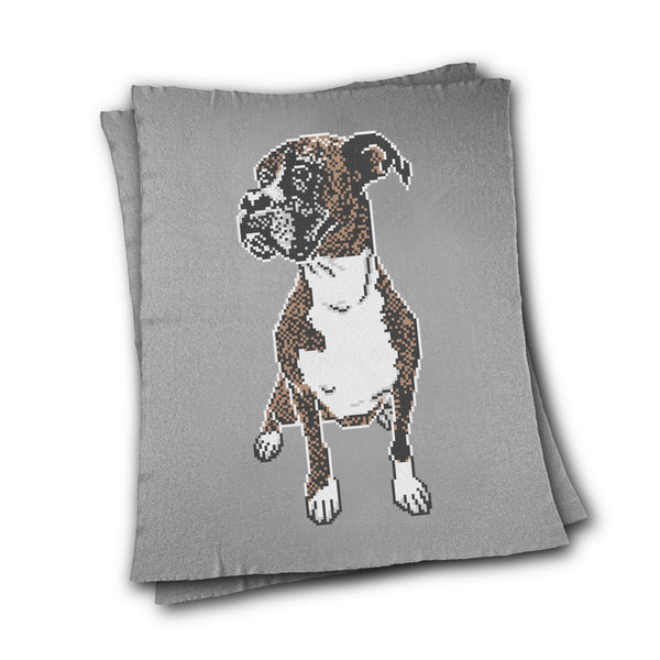 Grey knitted blanket with a dog's portrait knitted in